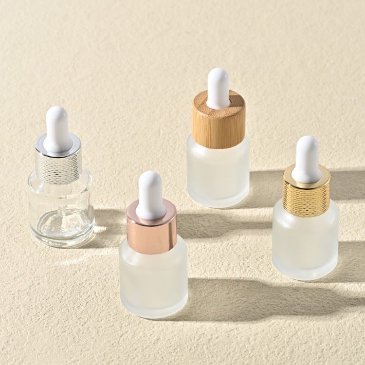 cosmetic glass bottle with gold dropper